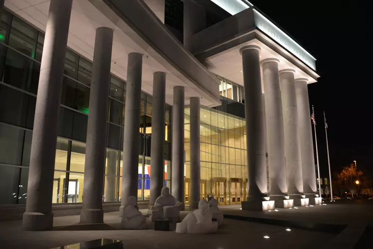 The front of the judicial building at night